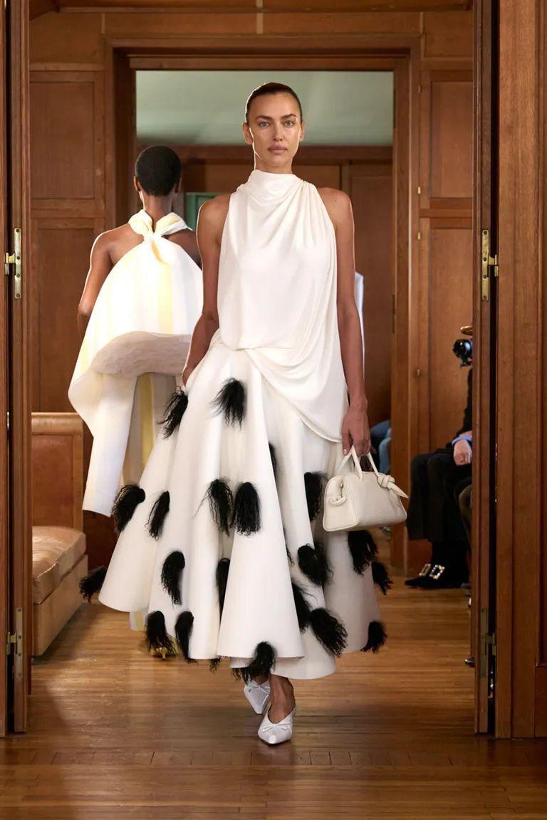Ivory draped halter top and sculpted full skirt with black feather applique by AKUVEE